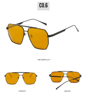 Detail view of double bridge aviator sunglasses with yellow lenses and black metal frames