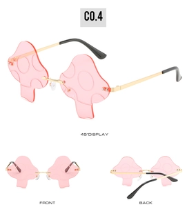 Three-way view showing pink mushroom-shaped rimless sunglasses with gold metal temples