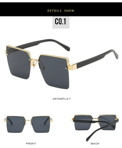 Close-up of semi-rimless square sunglasses featuring gold metal frames and gradient grey lenses