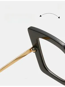 Close-up of durable metal texture hinge on black and gold square optical frames