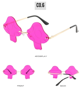 Detailed views of pink mushroom-shaped rimless sunglasses with embossed dot patterns