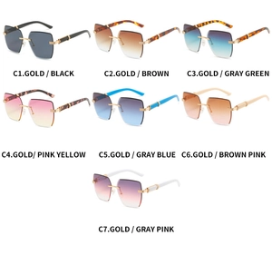 Collection of seven colorful rimless sunglasses with gradient lenses and gold metal temples