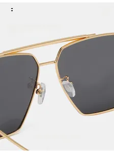 Close-up of comfortable nose pads on gold metal double bridge aviator sunglasses