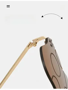 Detail of durable golden metal hinges on stylish mushroom-shaped sunglasses for women