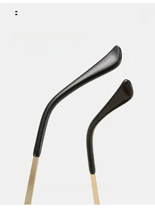Close-up of curved golden metal temples with black ergonomic tips for comfort wear