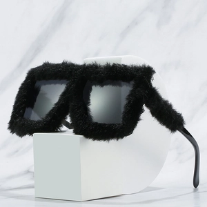 Fashionable black faux fur square sunglasses with cat eye frame on marble background