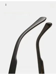 Detailed close-up of curved sunglasses temple legs in polished dark acetate finish