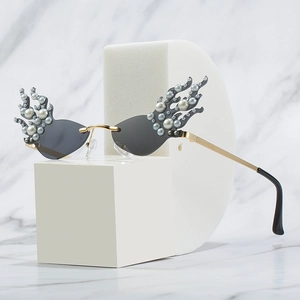Fashion flame shaped sunglasses with rhinestones and pearls on grey cat eye lenses
