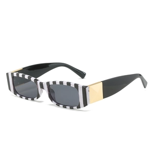 Retro rectangle sunglasses with black and white striped frames and gold metal accents