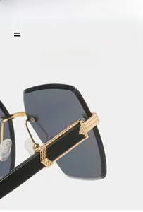 Detail of rimless sunglasses temple with woven gold metal accent and black material