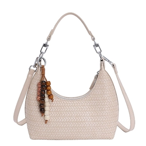 Beige woven crescent shoulder bag with wooden bead tassel on clean white background