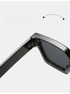 Detail of durable texture hinge on oversized square sunglasses with smooth finish