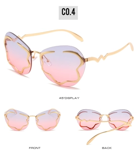 Vue sous trois angles de lunettes nuage sans monture avec branches dorées et dégradé