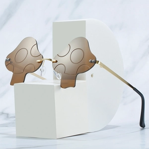 Fashionable rimless mushroom sunglasses with brown irregular lenses and gold metal temples
