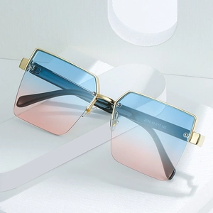 Modern semi-rimless square sunglasses with gold metal frame and blue-pink gradient lenses