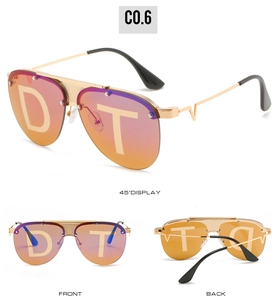 Detailansicht der Pilotensonnenbrille mit Goldfassung und orange-violetten Verlaufsgläsern