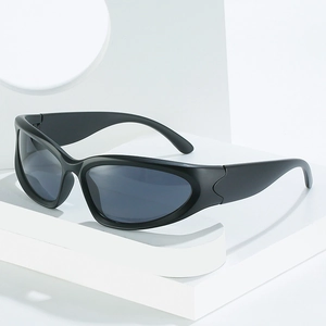 Steampunk wrap-around sunglasses with matte black frames on a geometric display stand