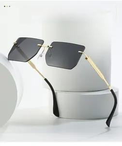 Detail of gold metal temples and textured hinge on rimless square gradient sunglasses