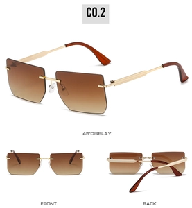 Detail view of rimless square sunglasses with brown gradient lenses and gold metal temples
