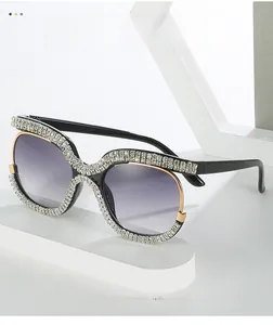 Detail of luxury oversized sunglasses with crystal-encrusted frames and gradient lenses