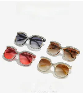 Detailed set of oversized square sunglasses with hand-set rhinestones and gradient lenses