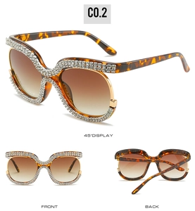 Macro detail of luxury oversized tortoiseshell sunglasses with sparkling crystal embellishments