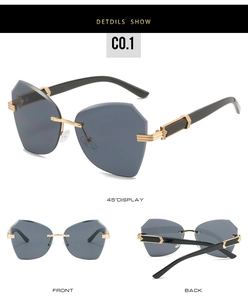 Detail show of frameless geometric sunglasses with gold metal arms and grey lenses