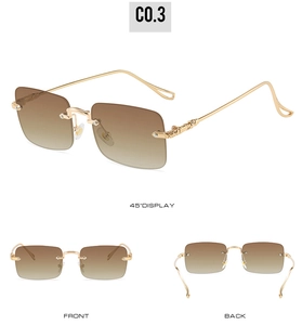Détail des lunettes de soleil carrées sans monture avec verres dégradés et branches dorées