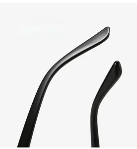 Detail view of ergonomic curved temple legs on glossy black round frame eyewear