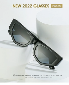 Close-up of black oversized cat eye glasses with anti-blue light lenses on a white pedestal