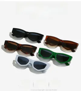 Flat lay of geometric cat-eye sunglasses in black, leopard, green, brown, and white