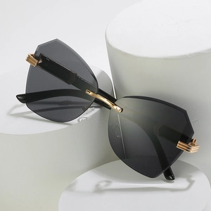 Fashionable rimless geometric sunglasses with grey lenses and gold metal hinges for women