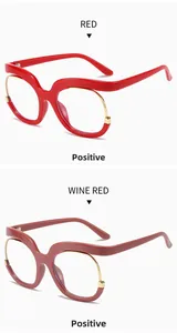 Detail of red and wine red oversized frames showing the stylish mixed metal and acetate design