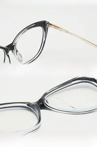 Detail of golden metal hinge and integrated nose pads on cat-eye glasses frames