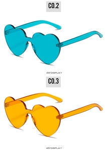 Detailed 45-degree view of heart shaped sunglasses in blue and yellow transparent plastic
