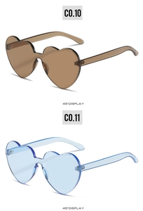 Detailed 45-degree side view of blue and brown heart-shaped rimless sunglasses