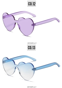 Vertical view of purple and blue gradient heart-shaped rimless party sunglasses