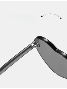 Detail of durable metal hinges and transparent grey frames on heart sunglasses