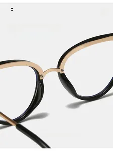 Detail of comfortable integrated nose pads on black and gold cat-eye glasses frames