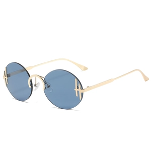 Lunettes de soleil rondes sans monture avec verres bleus et branches en métal doré à 45 degrés