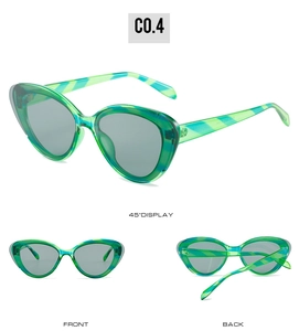 Three-way view of green tortoiseshell cat-eye sunglasses with dark grey lenses