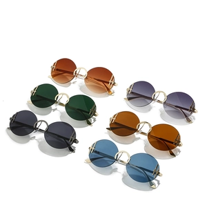 Lunettes de soleil rondes sans monture avec cadre en acier inoxydable et verres dégradés
