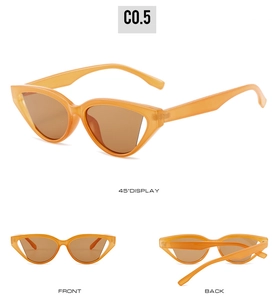 Detail view of orange cat eye sunglasses with translucent frames and brown lenses