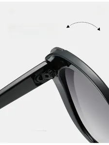 Macro detail of a black cat-eye sunglass frame with a durable texture metal hinge