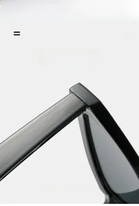 Macro detail of glossy black cat-eye sunglasses hinge with lightweight elastic texture