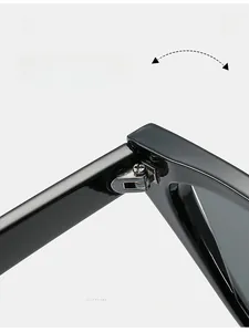 Detail shot of durable silver metal hinges on black cat eye sunglasses frame