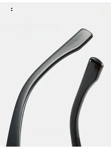 Detail of ergonomic curved black sunglass temples with a high-gloss finish for comfort