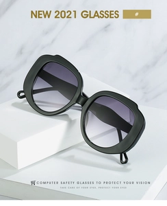 Detail of matte black irregular wavy frame sunglasses with purple gradient lenses