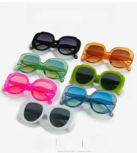 Flat lay of colorful thick-frame rhombic sunglasses in various vibrant candy colors