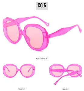 Three perspectives of pink oversized diamond sunglasses with translucent candy finish